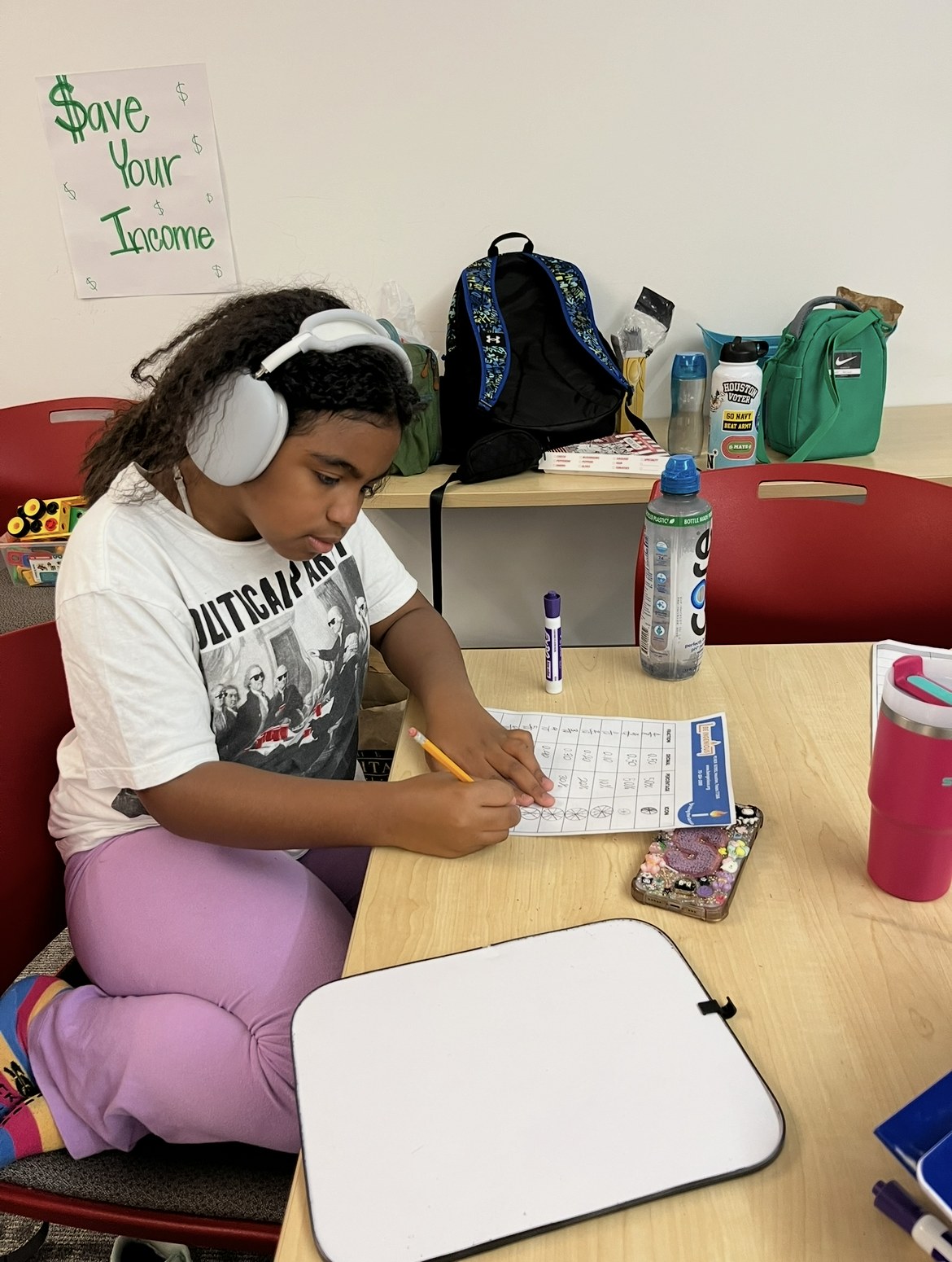 A student working on a math worksheet at BEyond School